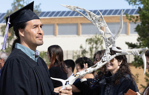 2023 grad valedictorian with the ceremonial antler. 
